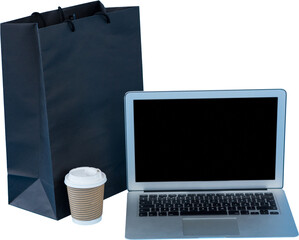 Laptop, disposable cup and paper bag