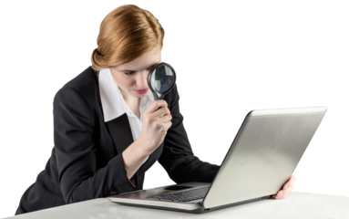 Redhead businesswoman using her laptop