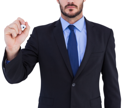 Focused businessman writing with marker