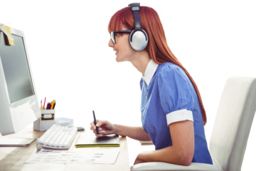 Attractive hipster woman with headset using graphics tablet 
