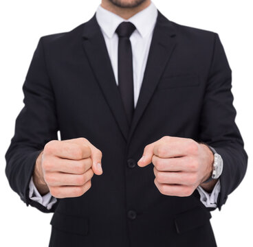 Elegant businessman in suit clenching his fists