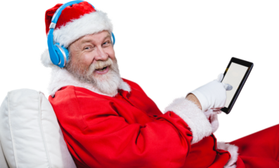 Portrait of Santa Claus listening music with digital tablet 