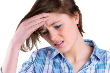 Pretty brunette getting a headache with hands on head