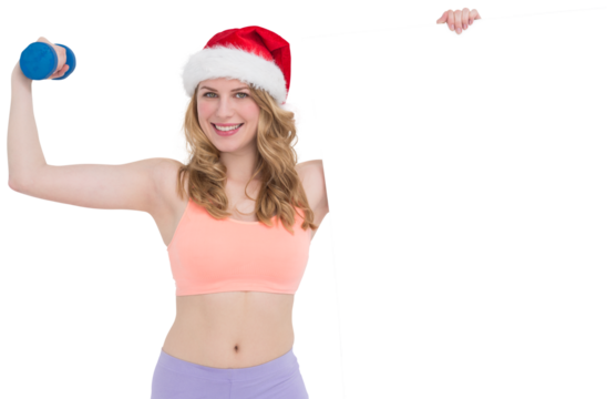 Festive fit blonde smiling at camera holding poster