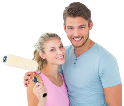 Young couple hugging and holding paint roller