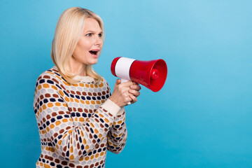 Profile photo of impressed unsatisfied person arms hold loudspeaker look empty space isolated on blue color background