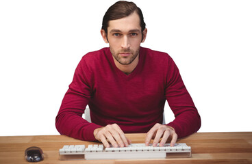 Portrait of serious man typing on keyboard at desk