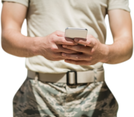 Close-up of military using mobile phone 
