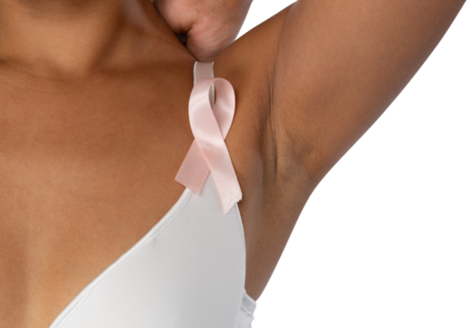 Woman standing for breast cancer awareness in white bra with pink ribbon against white background