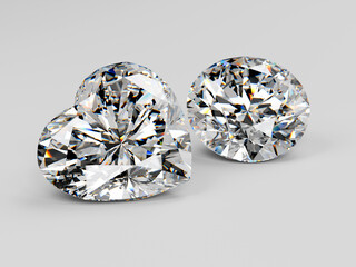 Two diamonds of round, heart brilliant cut  on white background