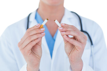  Doctor holding broken cigarette 