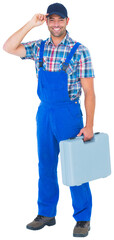 Happy manual worker wearing cap while carrying toolbox