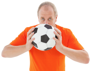Nervous football fan holding ball