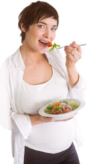 Portrait of pregnant woman eating salad