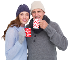Happy couple in warm clothing holding mugs