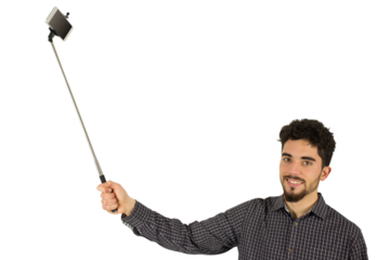 Casual man using a selfie stick