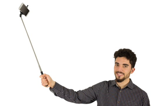 Casual man using a selfie stick