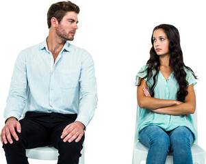 Couple sitting on chairs not talking after argument