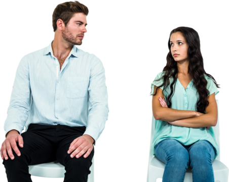 Couple sitting on chairs not talking after argument