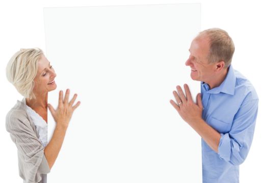 Mature couple smiling and holding card