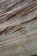 Fototapeta premium Natural biege tavertine with green and brown onyx inclusion diagonal vein