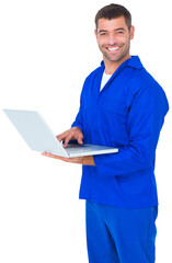 Happy mechanic using laptop on white background
