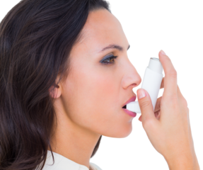 Asthmatic brunette using her inhaler 