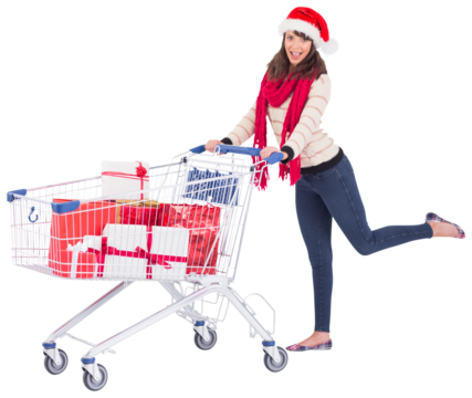 Cute woman in santa hat with shopping trolley