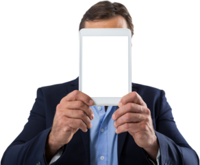 Businessman hiding his face behind digital tablet