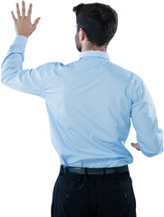 Rear view of businessman pretending to touch invisible screen