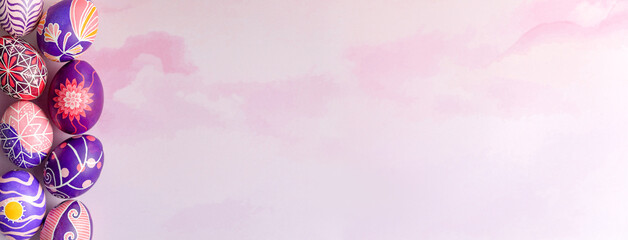 Easter banner with beautiful Easter eggs with flower painted in pink, lilac and violet colors