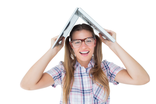 Geeky hipster holding her laptop over her head 