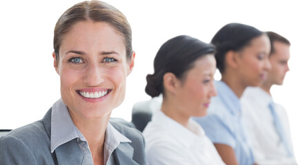 Portrait of smiling businessman with colleagues in conference