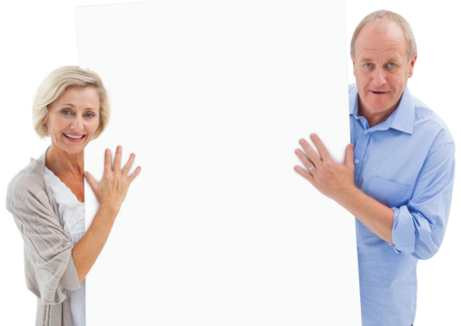 Mature couple smiling and holding card