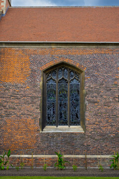 Beautiful stained glass in medieval window architecture at a historical college in Cambridge