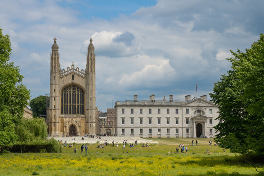 People enjoy nice weather at the grounds of Kings College in Cambridge in summer