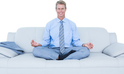 businessman meditating in yoga pose