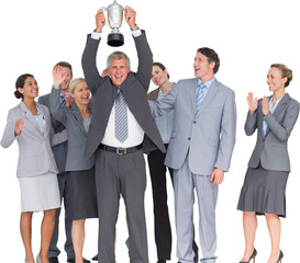Excited business team cheering at camera with trophy