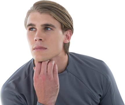 Thoughtful young businessman with hand on chin