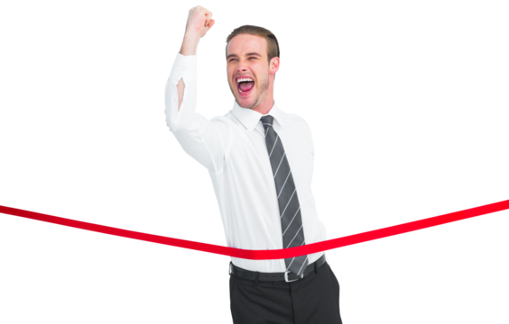Businessman crossing the finish line while clenching fist - Powered by Adobe