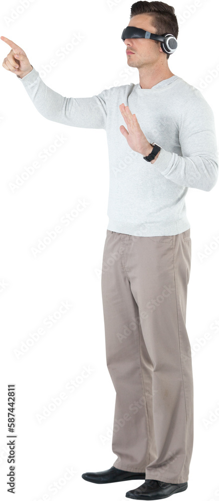 Poster full length of young man pointing while using virtual reality headset