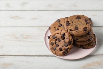chocolate chip cookies on wooden table, chocolate chip cookies on wooden table, chocolate chip cookies on a pink plate on a white wooden table