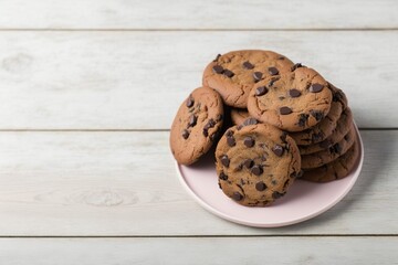 chocolate chip cookies on wooden table, chocolate chip cookies on wooden table, chocolate chip cookies on a pink plate on a white wooden table