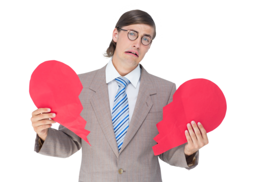 Geeky businessman crying and holding broken heart card - Powered by Adobe