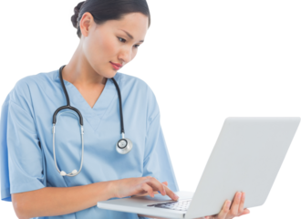 Concentrated surgeon using a laptop in hospital