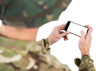 Mid section of soldier using mobile phone