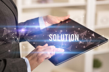 Close up hands using tablet