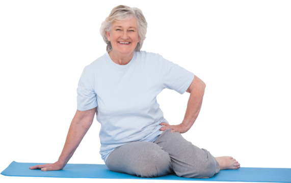 Senior woman smiling on exercise mat - Powered by Adobe