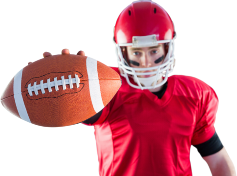 Portrait of american football player showing football to camera - Powered by Adobe