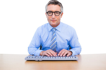 Businessman using computer keyboard at desk